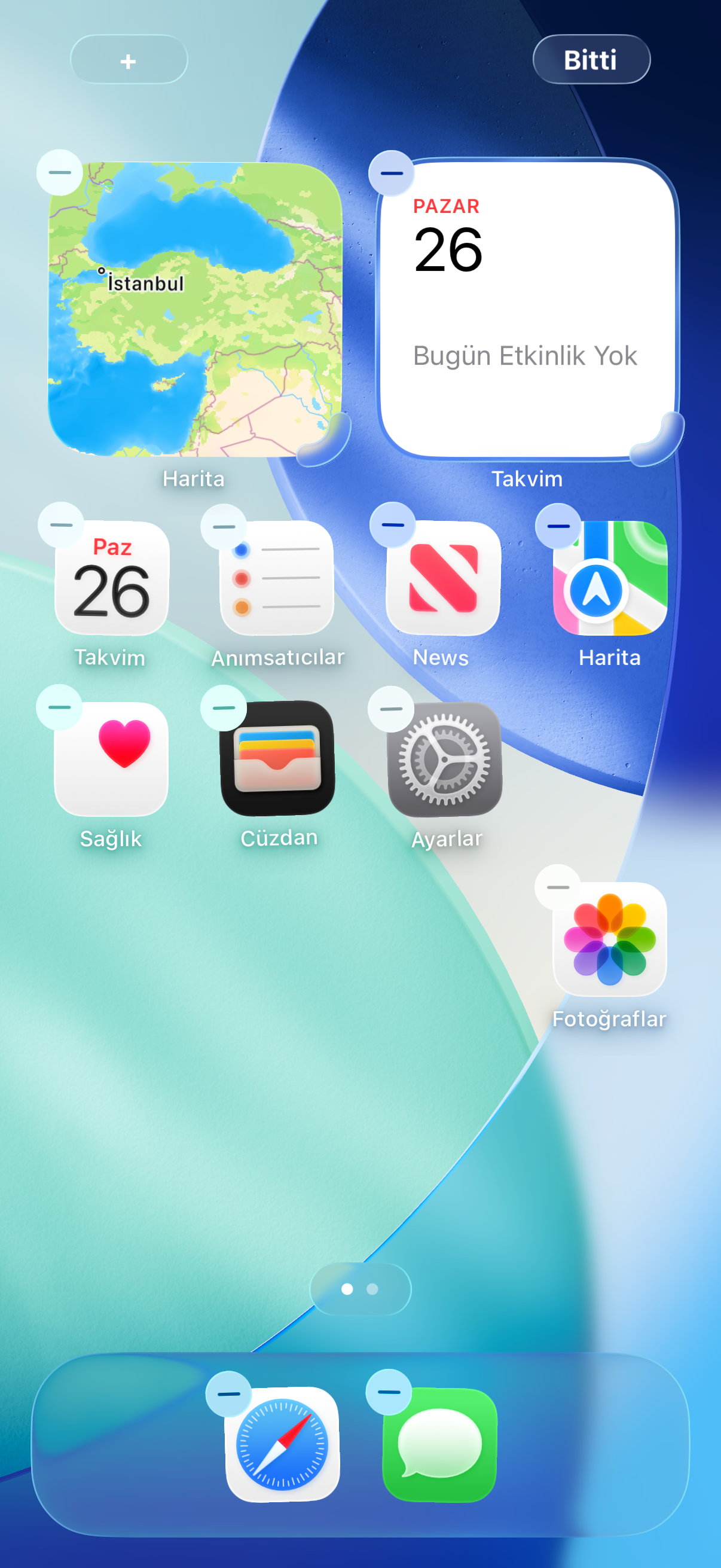 iOS 26 ana ekranında Fotoğraflar uygulamasının yeni konuma taşındığını gösteren gerçek arayüz